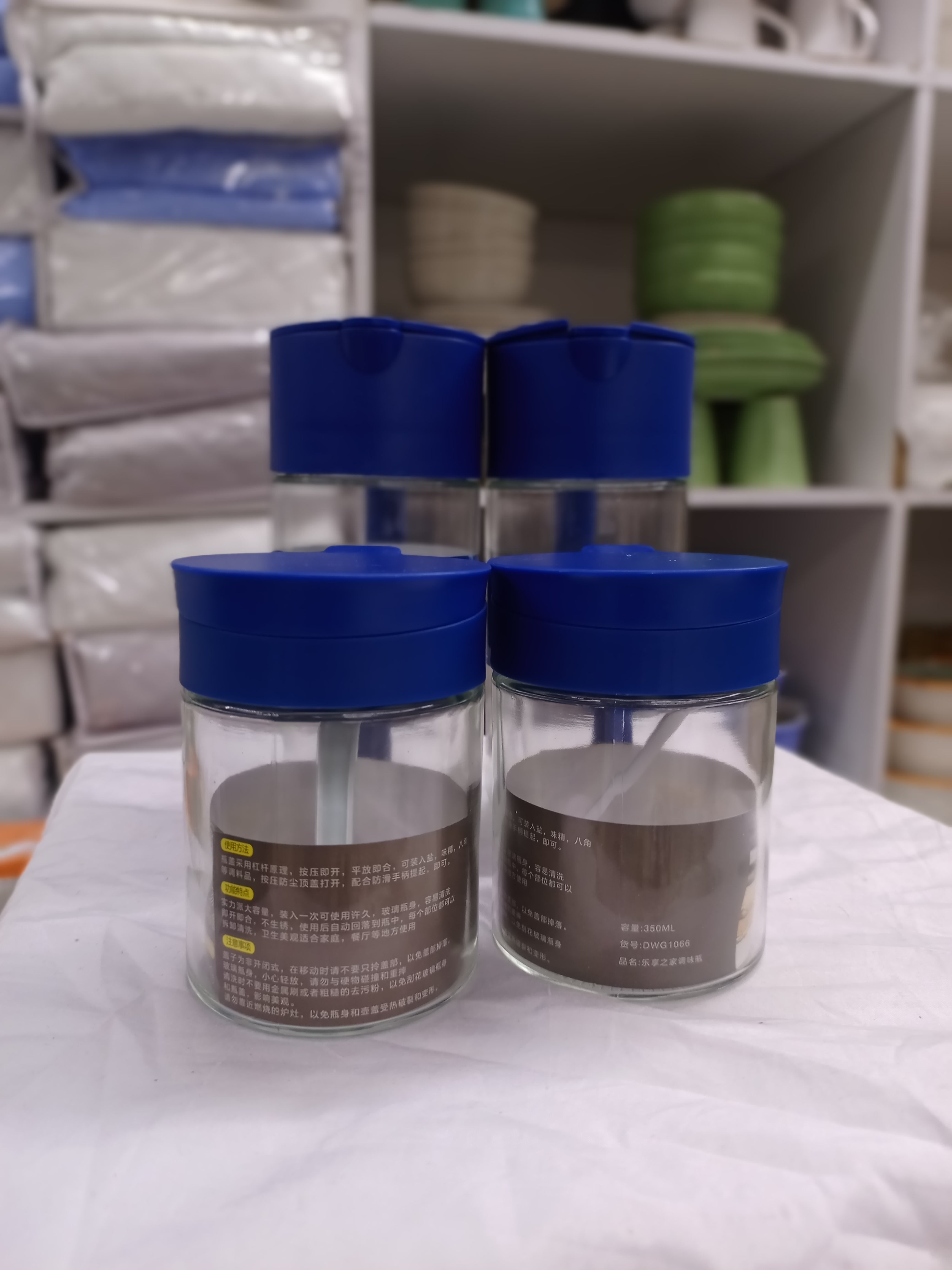 4-Piece Glass Oil and Spice Jar Set with Blue Lids & Spoons