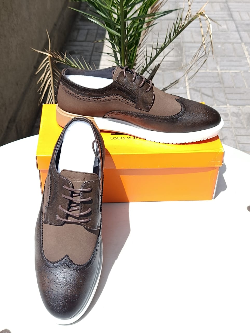 Louis Vuitton wingtip brogue shoes.
