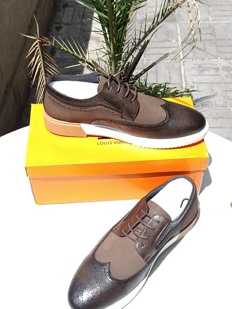 Louis Vuitton wingtip brogue shoes.